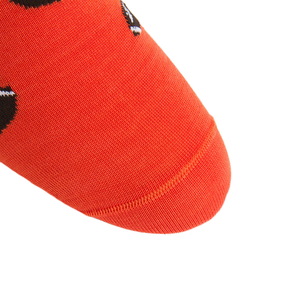 Linked-toe tigerlily orange sock with brown football