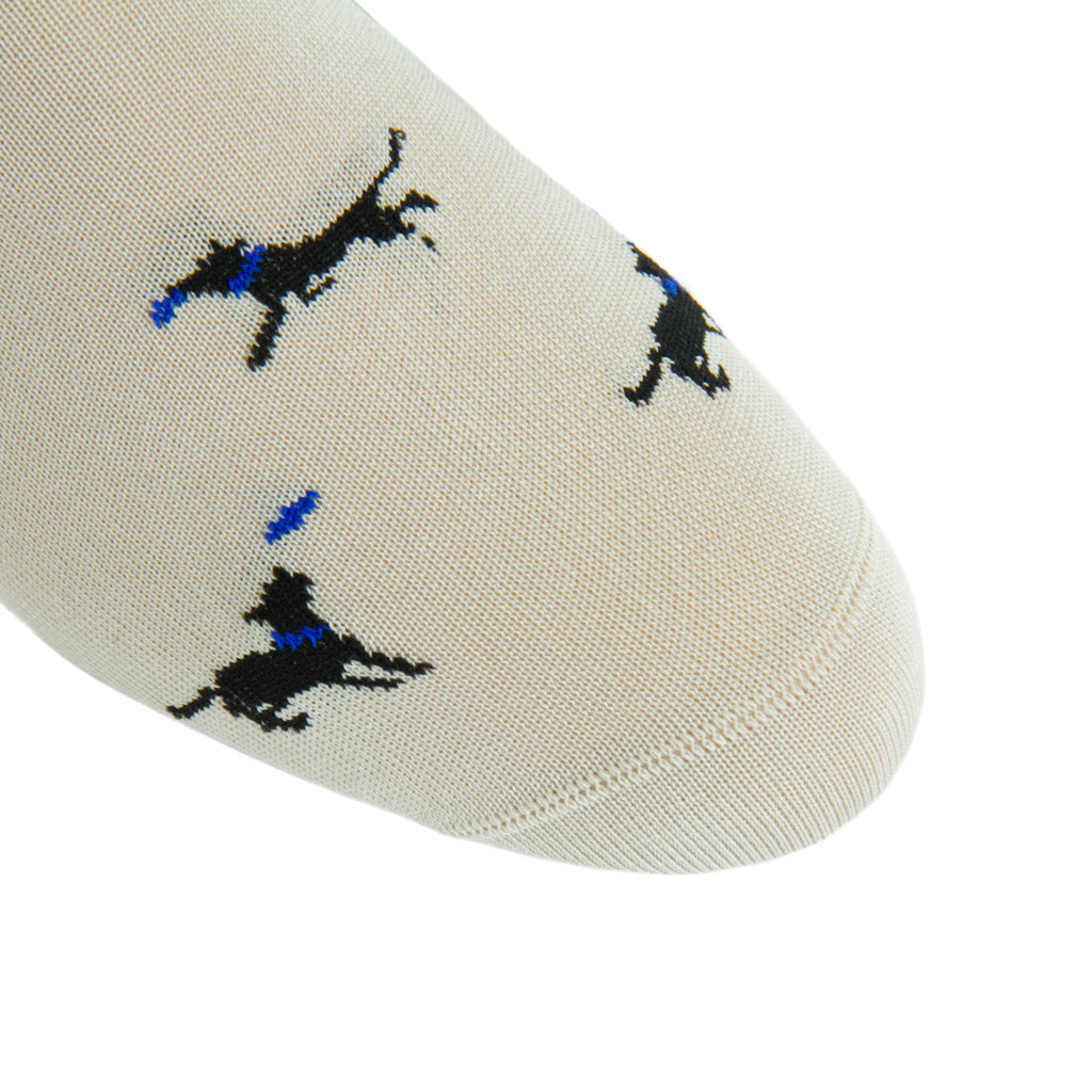 linked-toe tan with black dog catching frisbee