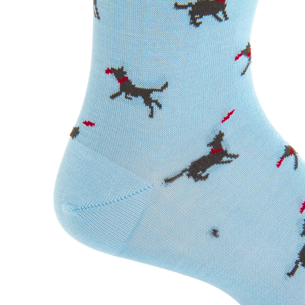 mid-calf sky blue/brown dog catching frisbee