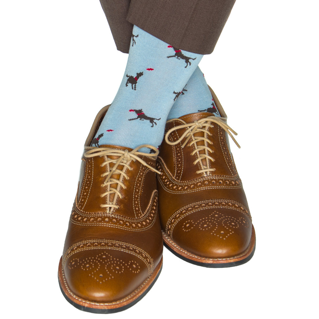 sky blue sock with brown dog catching a frisbee cotton