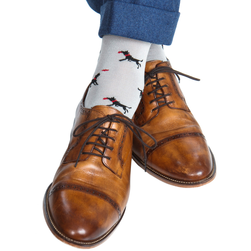 over-the-calf ash sock with black dog catching frisbee